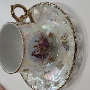 Elegant Gold and Purple Teacup and Saucer Set